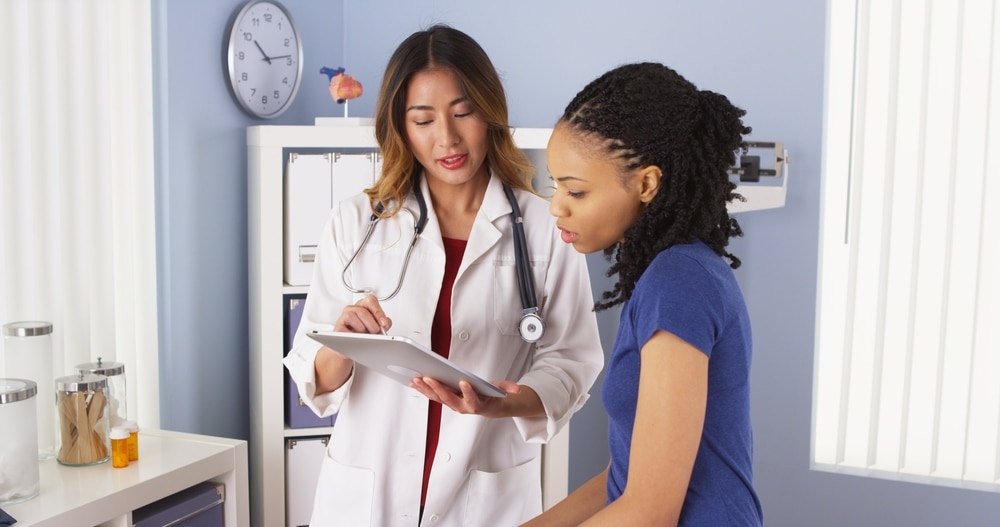 A doctor talking with a patient.
